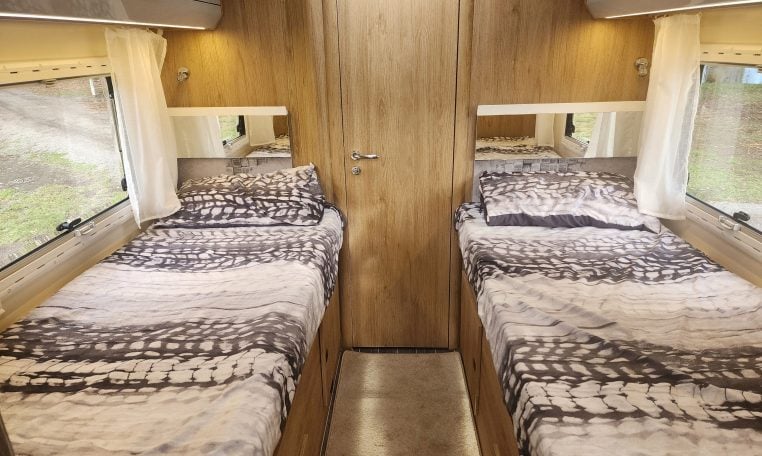 2019 Roller Team T-Line 785 interior view showing the fixed twin single beds.