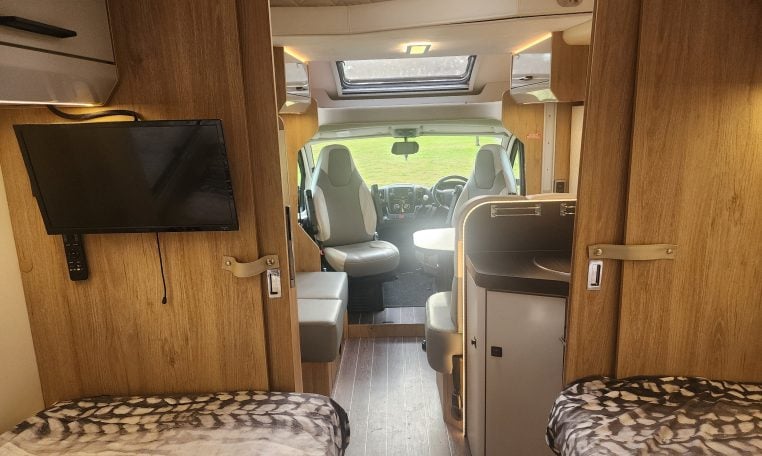 2019 Roller Team T-Line 785 interior view showing the TV in the bedroom.
