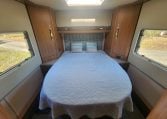 2020 Auto-Trail Delaware interior view showing the rear island bed in the bedroom.