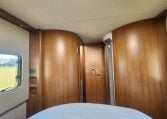 2020 Auto-Trail Delaware interior view in the bedroom looking towards the bathroom.