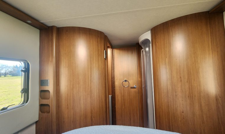 2020 Auto-Trail Delaware interior view in the bedroom looking towards the bathroom.