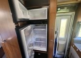 2020 Auto-Trail Delaware interior showing the fridge with doors open.