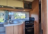 2020 Auto-Trail Delaware interior showing the kitchen with oven and grill.