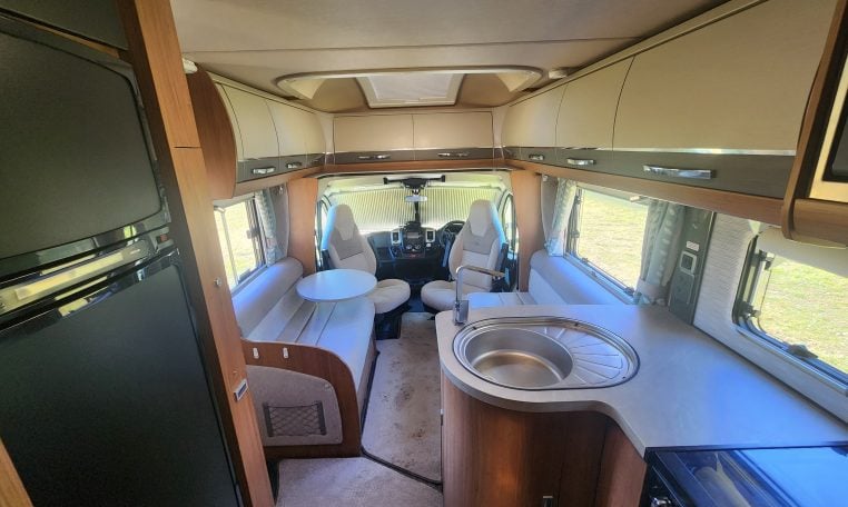 2020 Auto-Trail Delaware interior view showing the motorhome kitchen and front lounge layout.
