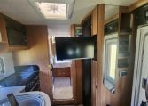 2020 Auto-Trail Delaware interior showing the slide out TV.