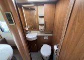 2020 Auto-Trail Frontier Delaware interior showing the compact toilet and handbasin setup.