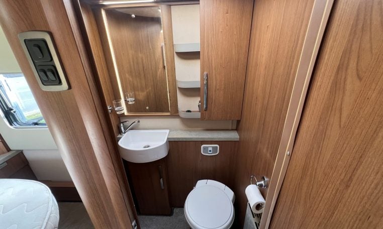 2020 Auto-Trail Frontier Delaware interior showing the compact toilet and handbasin setup.