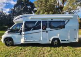 2020 Benimar Mileo 286 motorhome exterior view of the habitation door showing the awning.