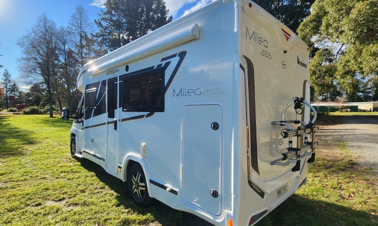 2020 Benimar Mileo 286 motorhome exterior rear and habitation side view showing the awning.