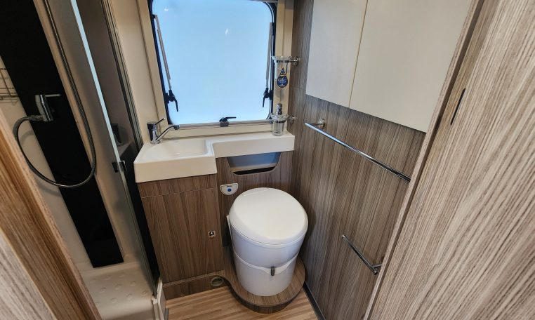 2020 Benimar Mileo 286 motorhome interior view of the bathroom showing the toilet.