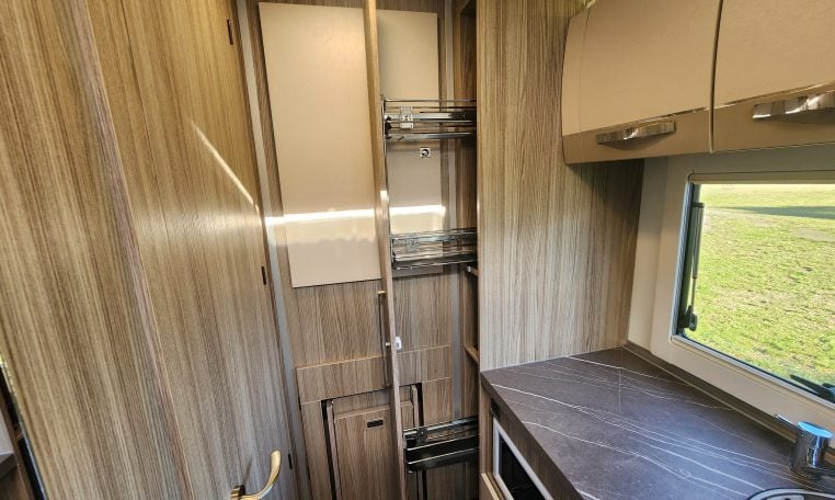 2020 Benimar Mileo 286 motorhome interior view showing the slide out pantry in the kitchen.