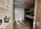 2020 Benimar Mileo 286 motorhome interior view showing the wardrobe in the kitchen for extra storage.
