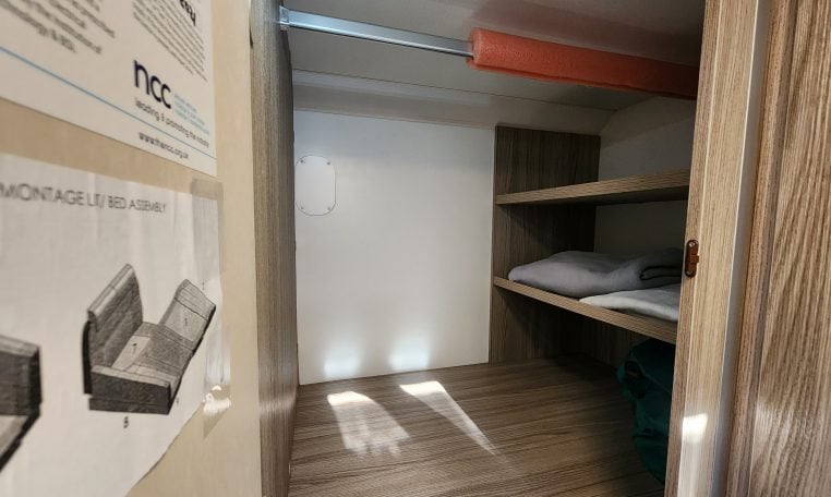 2020 Benimar Mileo 286 motorhome interior view showing the wardrobe in the kitchen for extra storage.