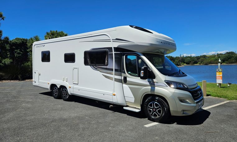 Side view of an Auto-Trail Frontier Comanche motorhome showing the driver's door.