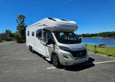 Front-side view of an Auto-Trail Frontier Comanche motorhome showing cab and camper exterior.