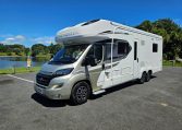 Exterior profile of the Auto-Trail Frontier Comanche motorhome showing side view, windows, and overall design layout.