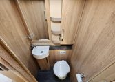 Interior view of the Auto-Trail Frontier Comanche motorhome bathroom with toilet and modern design.
