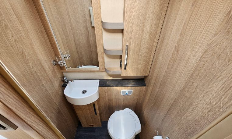 Interior view of the Auto-Trail Frontier Comanche motorhome bathroom with toilet and modern design.