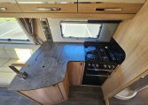 Stove and oven in the Auto-Trail Frontier Comanche motorhome kitchen for convenient cooking while traveling.