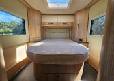 Auto-Trail Frontier Comanche motorhome interior with rear island bed and walk-around sleeping space.