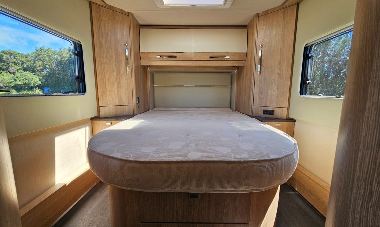 Auto-Trail Frontier Comanche motorhome interior with rear island bed and walk-around sleeping space.