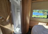 Auto-Trail Frontier Comanche motorhome bathroom with a separate shower and contemporary interior design.