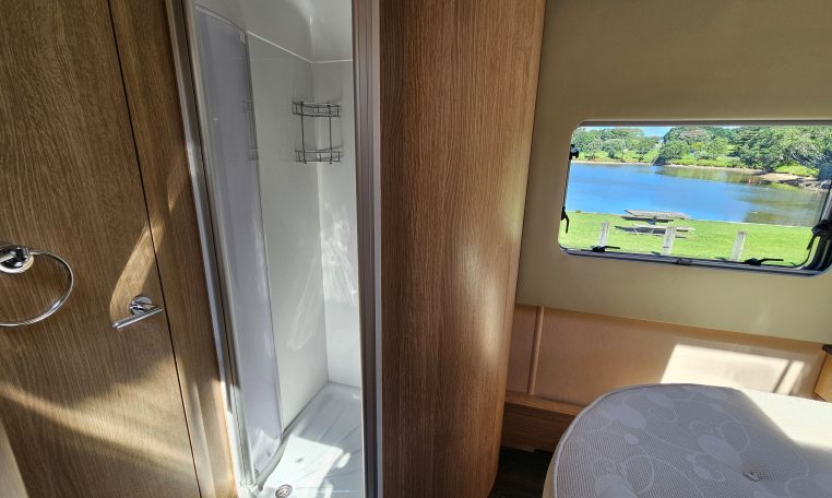 Auto-Trail Frontier Comanche motorhome bathroom with a separate shower and contemporary interior design.