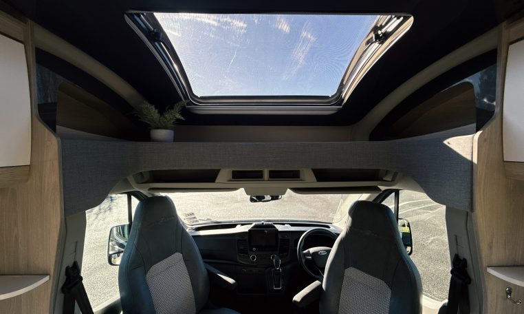 2021 Auto-Trail F-Line F74 interior view showing the sunroof over the cab bringing in natural light.