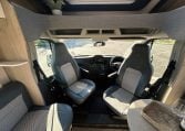 2021 Auto-Trail F-Line F74 interior view showing the cab swivel seats providing more seating in the lounge.