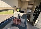 2021 Auto-Trail F-Line F74 interior view showing the front lounge and kitchen layout.