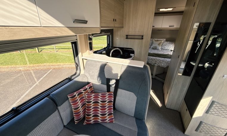 2021 Auto-Trail F-Line F74 interior view showing the front lounge and kitchen layout.
