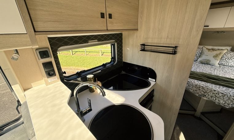 2021 Auto-Trail F-Line F74 interior view showing the compact motorhome kitchen.