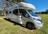 2021 Auto-Trail Frontier Comanche motorhome exterior view showing the front and driver's side.