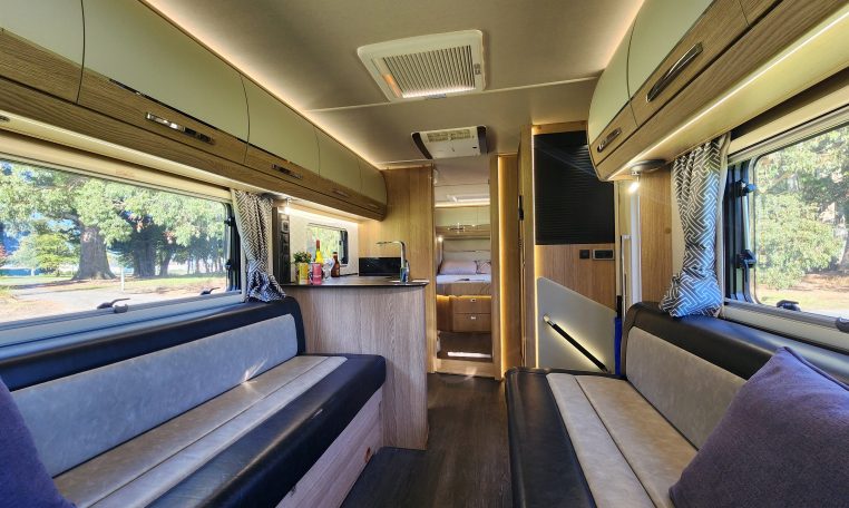 2021 Auto-Trail Frontier Comanche motorhome interior view of the high spec upholstery in the front lounge.
