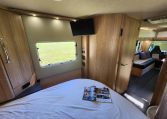 2021 Auto-Trail Frontier Comanche motorhome interior view of the TV in the bedroom.