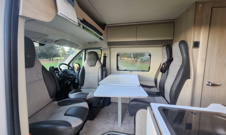 2021 Auto-Trail Tribute T680 motorhome interior view of the front lounge and dining.
