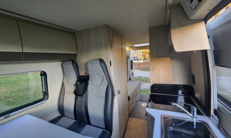 2021 Auto-Trail Tribute T680 motorhome interior view showing the passenger seatbelts.