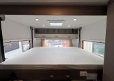 2021 Jayco Conquest FA24-4 interior view of the drop-down bed for extra sleeping space.