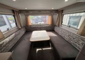 2021 Jayco Conquest FA24-4 interior view of the rear lounge with dining table.