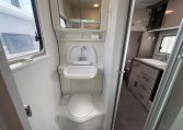 2021 Jayco Conquest FA24-4 interior view of the compact toilet and handbasin.