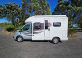 Exterior view of the Auto-Trail F-Line F62 motorhome showing the habitation door and surrounding side profile.