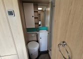 Interior view of the Auto-Trail F-Line F62 motorhome bathroom with shower and modern design.