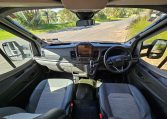 Auto-Trail F-Line F62 motorhome cab with dashboard layout, seating, and driving controls for comfort and functionality.