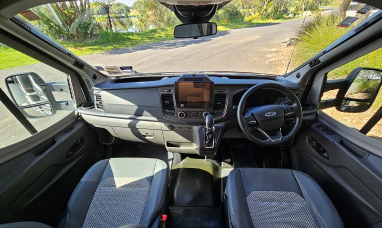 Auto-Trail F-Line F62 motorhome cab with dashboard layout, seating, and driving controls for comfort and functionality.
