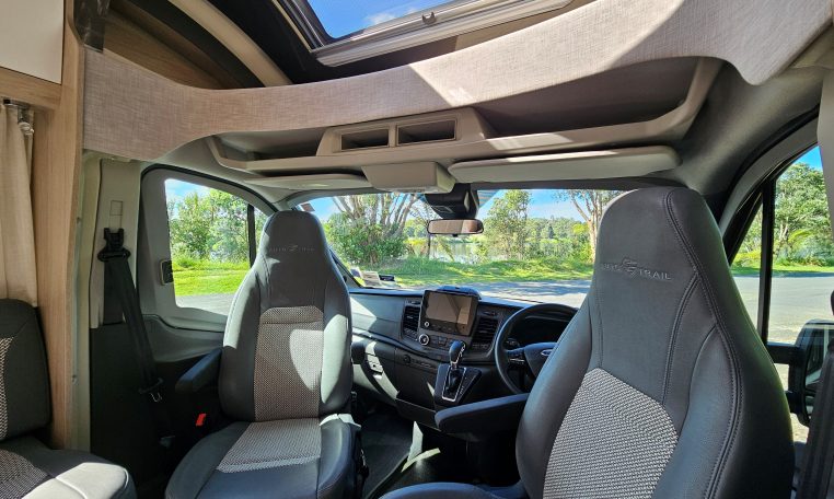 Cab swivel seats in an Auto-Trail F-Line F62 motorhome, rotating driver and passenger seats to face the living area for added comfort.