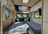 Front lounge area in the Auto-Trail-F-Line-F62 converting into a comfortable double bed for flexible living.