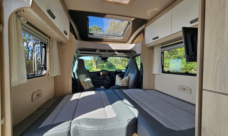 Front lounge area in the Auto-Trail-F-Line-F62 converting into a comfortable double bed for flexible living.