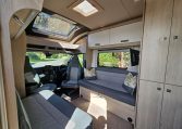Convenient overhead storage cupboards inside the Auto-Trail F-Line F62 motorhome front lounge.