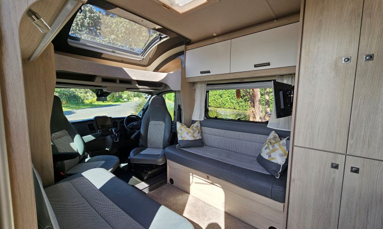 Convenient overhead storage cupboards inside the Auto-Trail F-Line F62 motorhome front lounge.