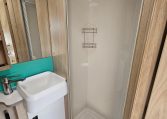 Interior view of the Auto-Trail F-Line F62 motorhome bathroom with handbasin and modern design.